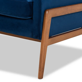 Baxton Studio Perris Mid-Century Modern Navy Blue Velvet Fabric Upholstered and Walnut Brown Finished Wood Lounge Chair